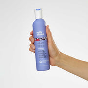 milk-shake-silver-shine-shampoo-in-hand